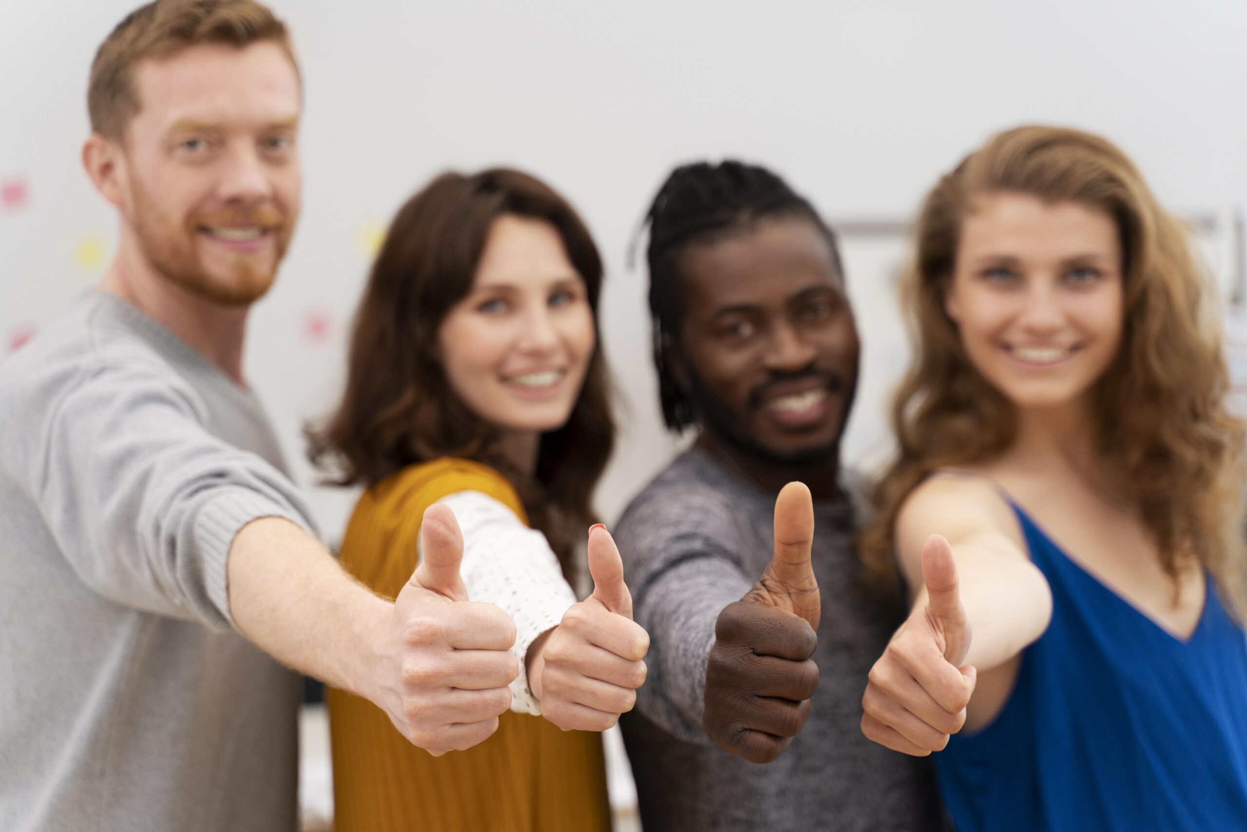 colleagues-with-thumbs-up-medium-shot-scaled